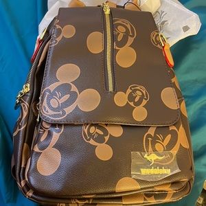 Mickey mouse backpack/ with satchel strap. Real leather. Never used with tags.